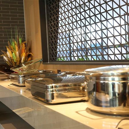 Qiu Guo Hotel Hua Mao Chaoyang  Extérieur photo